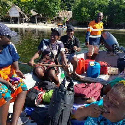 Research team travelling via boat in Solomon Islands