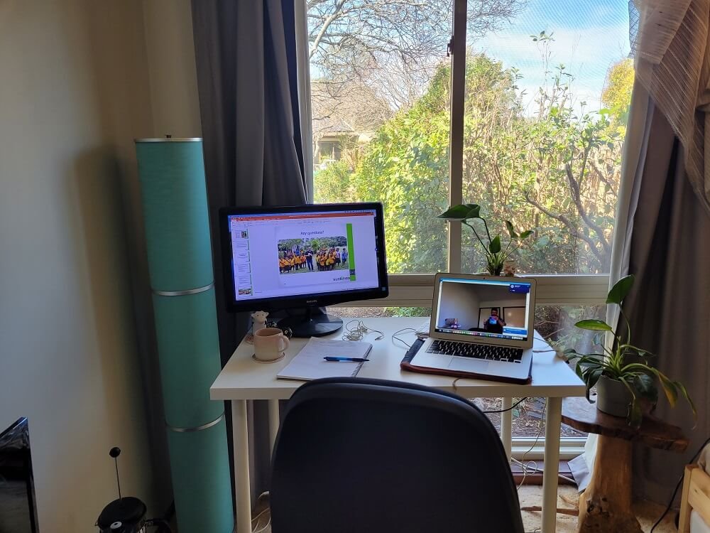 Photo of Tom's remote lecture setup, in his home office in front of a window