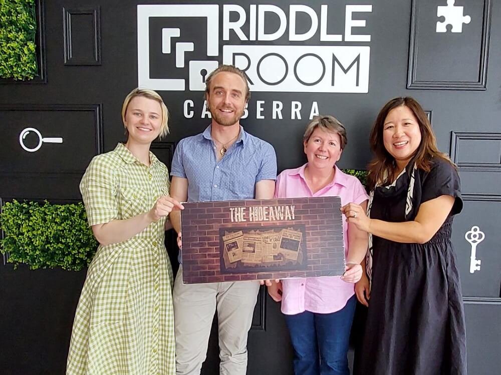 Nina, Rob, Nicky, and Min celebrate their win in our end of year Riddle Room team activity