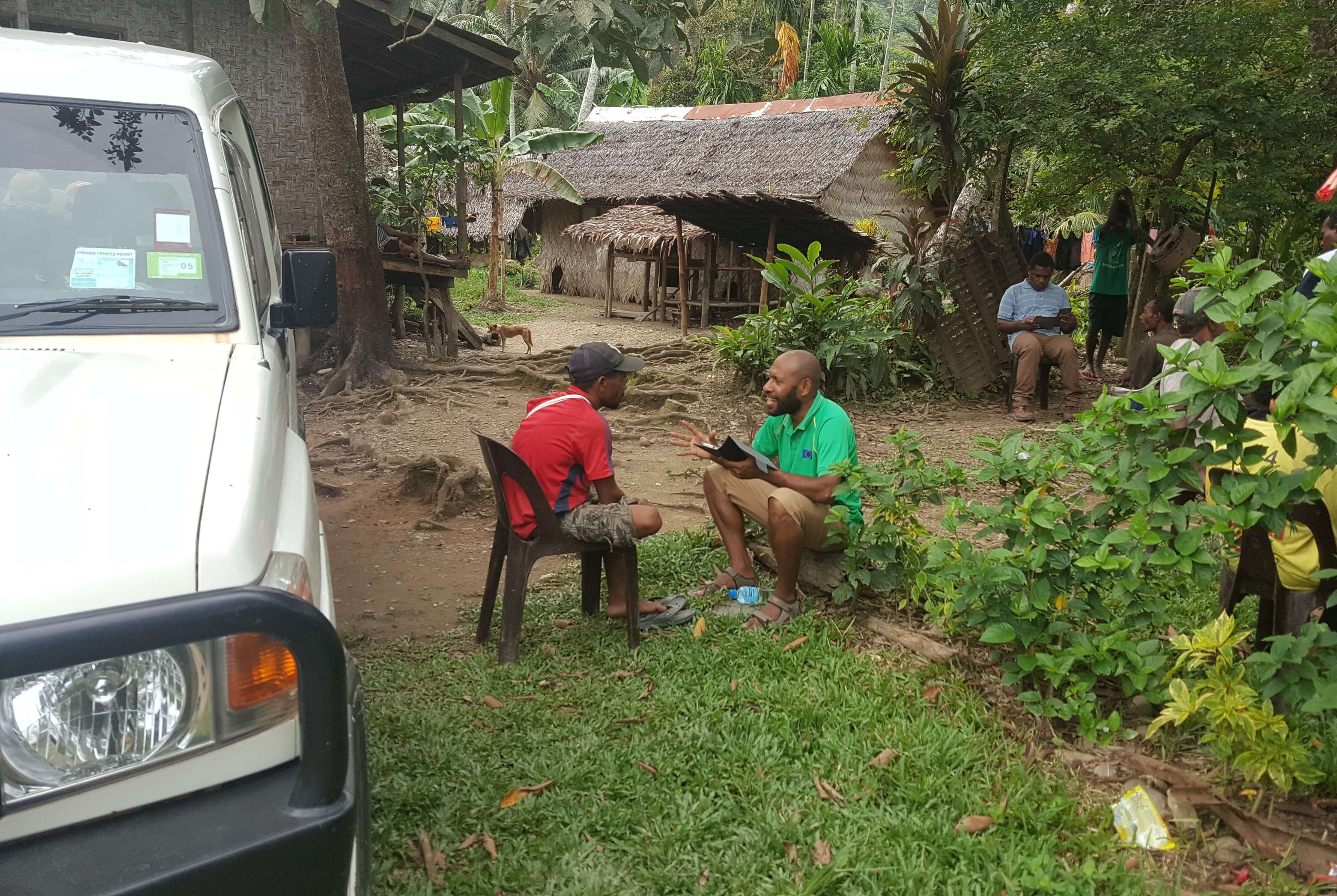 Two men sitting down talking