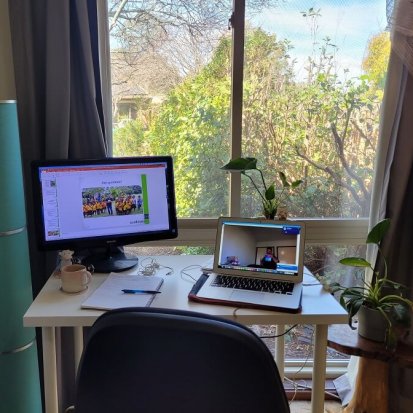 Photo of Tom's remote lecture setup, in his home office in front of a window