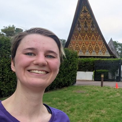 Nina smiling in front of the PNG High Commission in Canberra after completing a 5km fun run as part of the #runforfemiliPNG campaign